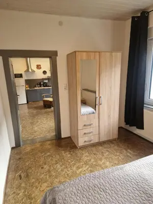 Ein Bett oder Betten in einem Zimmer der Unterkunft Ferienwohnung Wunderlich gelb