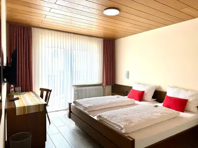 Ein Bett oder Betten in einem Zimmer der Unterkunft Pension Hubertus
