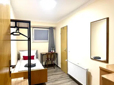 Ein Bett oder Betten in einem Zimmer der Unterkunft Pension Hubertus