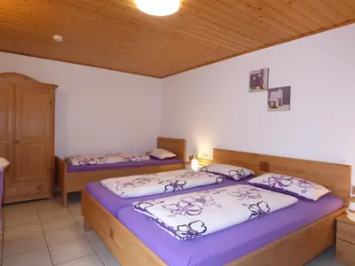 Ein Bett oder Betten in einem Zimmer der Unterkunft Ferienhaus Sylvia beim Waldrand