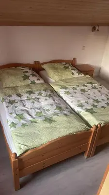 Ein Bett oder Betten in einem Zimmer der Unterkunft Lukashof