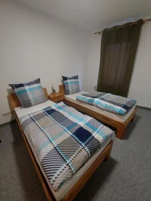 Ein Bett oder Betten in einem Zimmer der Unterkunft Selb Ferienwohnungen