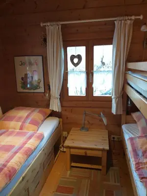 Ein Bett oder Betten in einem Zimmer der Unterkunft Naturerlebnisdorf Stamsried 3