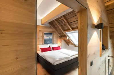 Ein Bett oder Betten in einem Zimmer der Unterkunft Ferienwohnung im Chaletstil Bergloft 115 qm Wellness Fitness Sauna Bergrödelhof