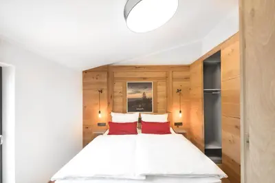 Ein Bett oder Betten in einem Zimmer der Unterkunft Ferienwohnung im Chaletstil Bergloft 115 qm Wellness Fitness Sauna Bergrödelhof