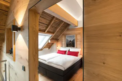 Ein Bett oder Betten in einem Zimmer der Unterkunft Ferienwohnung im Chaletstil Giebeltraum 115 qm Wellness Fitness Sauna Bergrödelhof