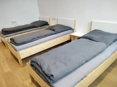 Ein Bett oder Betten in einem Zimmer der Unterkunft Zum Schulhaus