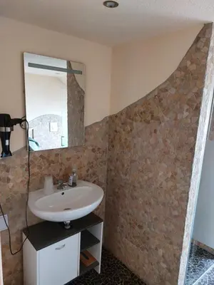 Ein Badezimmer in der Unterkunft Waldquelle