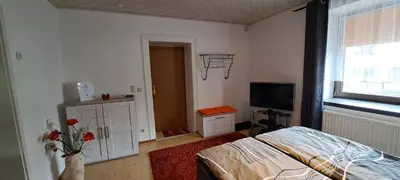 Ein Bett oder Betten in einem Zimmer der Unterkunft Zur alten Schmiede - Breitenbrunn/Erzgebirge