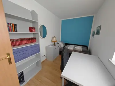 Ein Bett oder Betten in einem Zimmer der Unterkunft Apartment E2 - Gut ausgestattete 3-Zimmerwohnung 64 qm, für 1-3 Personen 1 DZ 1EZ