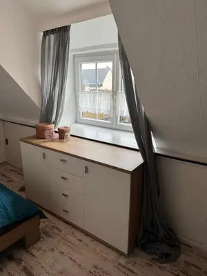 Ein Bett oder Betten in einem Zimmer der Unterkunft Kinofeeling im Reihenhaus mit schönem Garten
