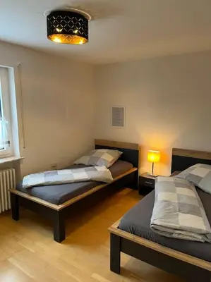 Ein Bett oder Betten in einem Zimmer der Unterkunft Ferienwohnung in ruhiger Lage