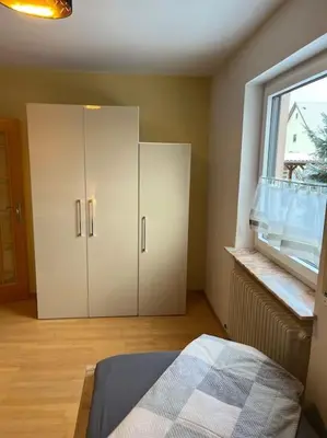 Ein Bett oder Betten in einem Zimmer der Unterkunft Ferienwohnung in ruhiger Lage