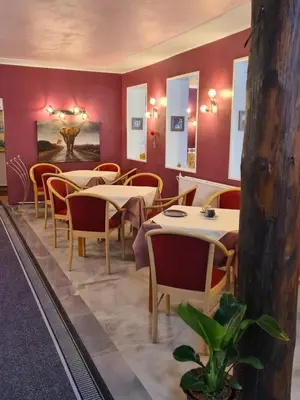 Ein Sitzbereich in der Unterkunft Pizzeria Pension Damiano