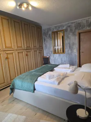 Ein Bett oder Betten in einem Zimmer der Unterkunft Pizzeria Pension Damiano
