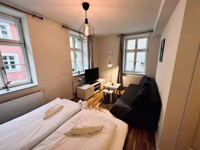 Ein Bett oder Betten in einem Zimmer der Unterkunft Zentrales charmantes Apartment im Altstadtkern