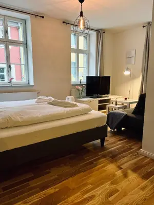 Ein Bett oder Betten in einem Zimmer der Unterkunft Zentrales charmantes Apartment im Altstadtkern