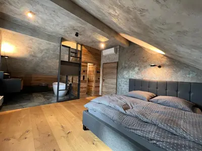 Ein Bett oder Betten in einem Zimmer der Unterkunft Appartement der Extraklasse mit Whirlpool