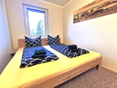 Ein Bett oder Betten in einem Zimmer der Unterkunft Ferienwohnung 