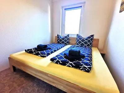 Ein Bett oder Betten in einem Zimmer der Unterkunft Ferienwohnung 