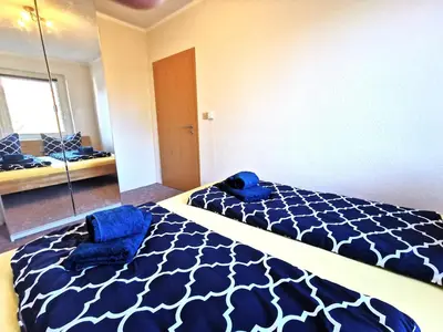 Ein Bett oder Betten in einem Zimmer der Unterkunft Ferienwohnung 