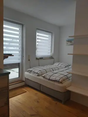 Ein Bett oder Betten in einem Zimmer der Unterkunft Ferienwohnung Munzert