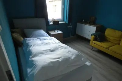 Ein Bett oder Betten in einem Zimmer der Unterkunft Dachterrasse