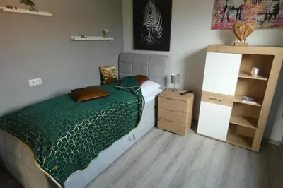 Ein Bett oder Betten in einem Zimmer der Unterkunft Dachterrasse