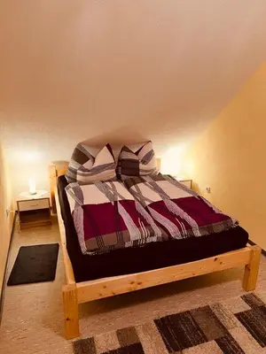 Ein Bett oder Betten in einem Zimmer der Unterkunft Ferienwohnung Erika