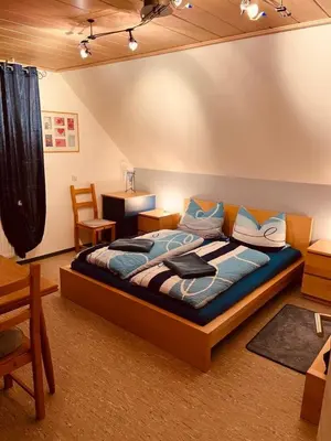 Ein Bett oder Betten in einem Zimmer der Unterkunft Ferienwohnung Erika