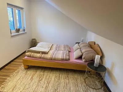 Ein Bett oder Betten in einem Zimmer der Unterkunft Ferienhaus Am Alten Kirchsteig