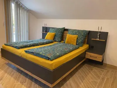 Ein Bett oder Betten in einem Zimmer der Unterkunft Ferienhaus Am Alten Kirchsteig