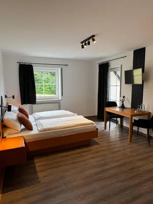 Ein Bett oder Betten in einem Zimmer der Unterkunft Hotel Gasthof zum Wulfen