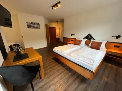 Ein Bett oder Betten in einem Zimmer der Unterkunft Hotel Gasthof zum Wulfen