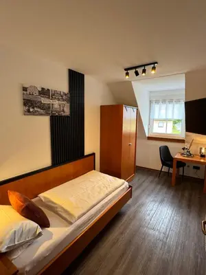 Ein Bett oder Betten in einem Zimmer der Unterkunft Hotel Gasthof zum Wulfen