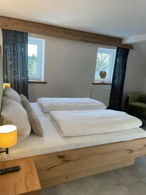 Ein Bett oder Betten in einem Zimmer der Unterkunft Hotel Gasthof zum Wulfen