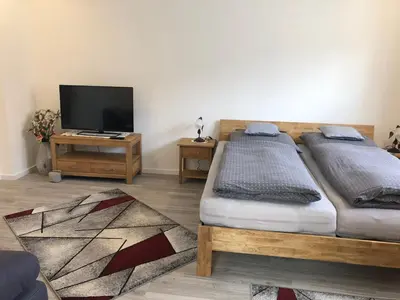 Ein Bett oder Betten in einem Zimmer der Unterkunft Ferienwohnung Alex