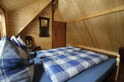 Ein Bett oder Betten in einem Zimmer der Unterkunft Ferienhaushälfte Gösselberg Anno Dazumal