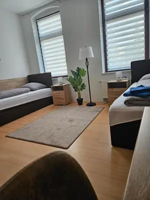 Ein Bett oder Betten in einem Zimmer der Unterkunft Ferienwohnung WESTEND