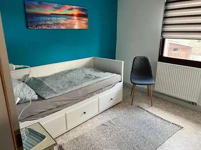 Ein Bett oder Betten in einem Zimmer der Unterkunft Gästehaus „Bei Emmi“