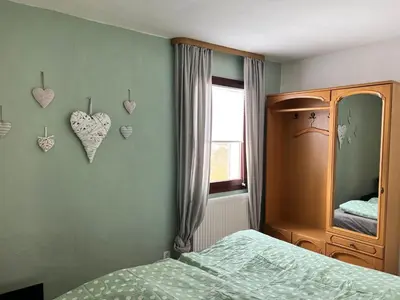Ein Bett oder Betten in einem Zimmer der Unterkunft Gästehaus „Bei Emmi“