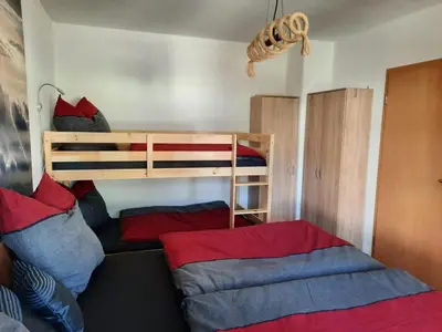 Ein Bett oder Betten in einem Zimmer der Unterkunft NEU! Geschmackvolle FeWo Lengenfeld