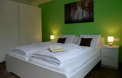 Ein Bett oder Betten in einem Zimmer der Unterkunft Am Quellenhäuschen
