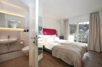 Ein Bett oder Betten in einem Zimmer der Unterkunft Aparthotel Minderleins Apart