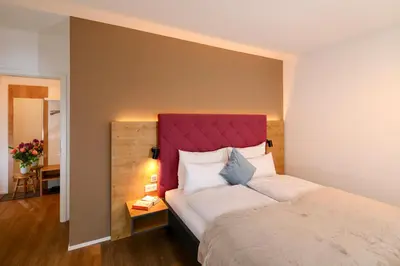 Ein Bett oder Betten in einem Zimmer der Unterkunft Aparthotel Minderleins Apart