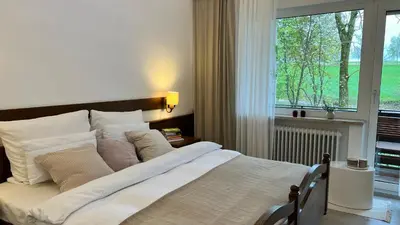 Ein Bett oder Betten in einem Zimmer der Unterkunft Unsereins Hotel