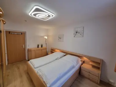 Ein Bett oder Betten in einem Zimmer der Unterkunft NEU FeWo Oberwiesenthal EG