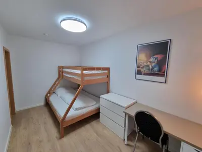 Ein Bett oder Betten in einem Zimmer der Unterkunft NEU FeWo Oberwiesenthal EG
