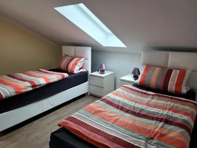 Ein Bett oder Betten in einem Zimmer der Unterkunft Ferienwohnung Schärl