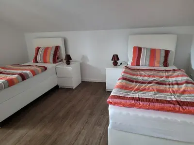 Ein Bett oder Betten in einem Zimmer der Unterkunft Ferienwohnung Schärl